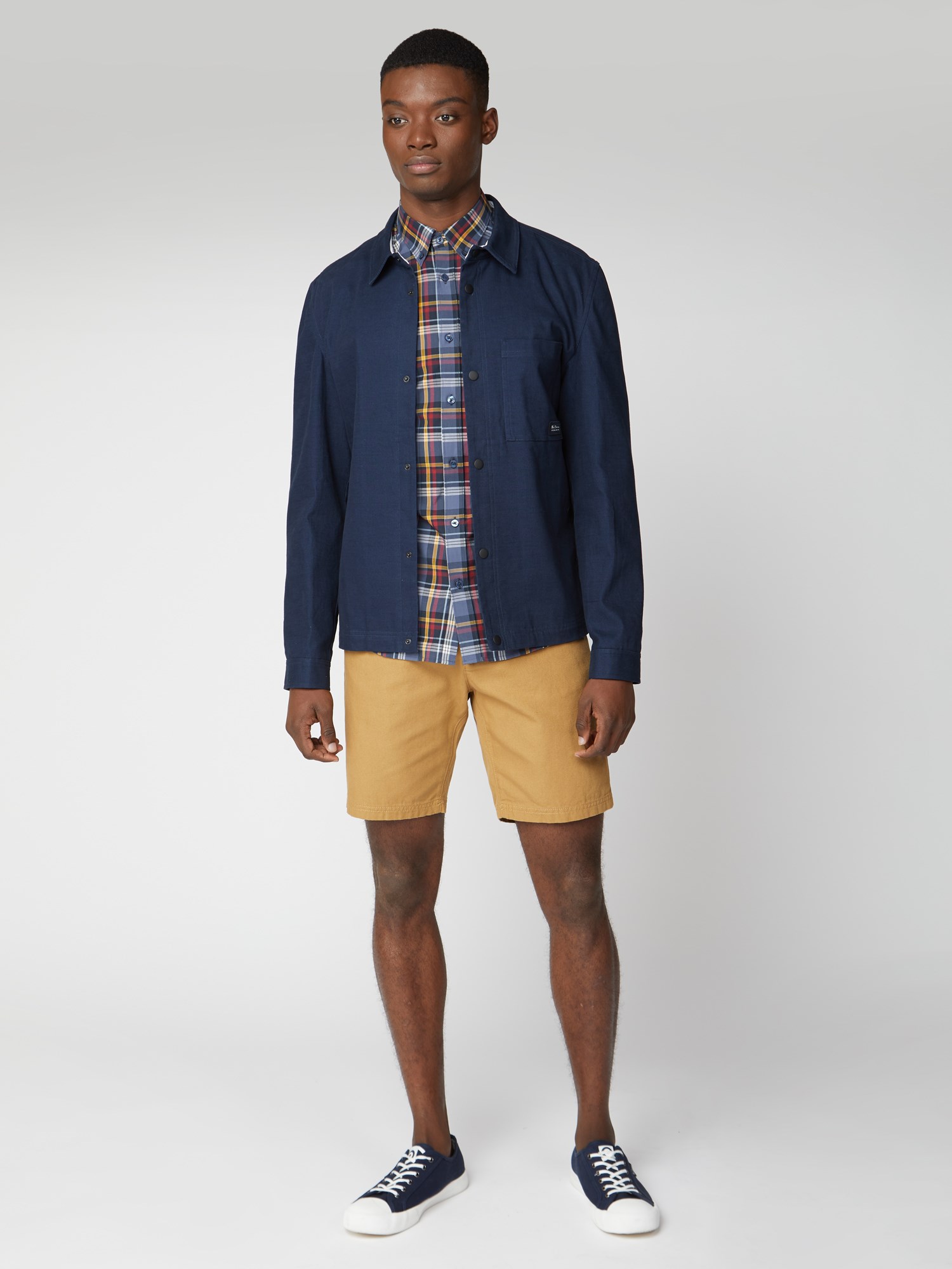 Brown shorts blue shirt 2025